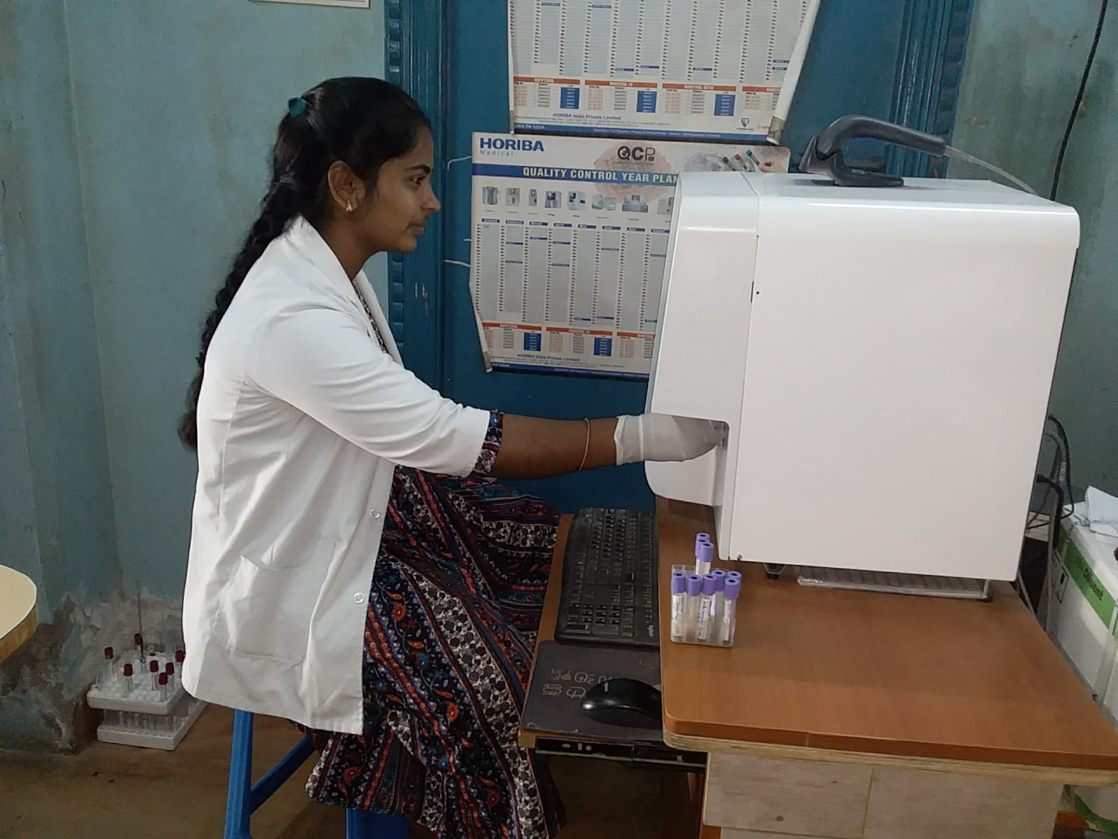 Student examining a hematology analyzer readout