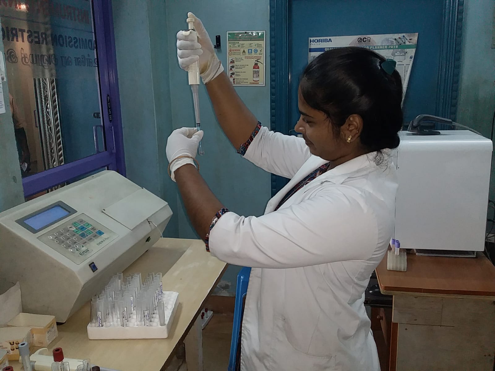 Student checking a patient's vitals during clinical training